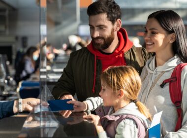 Passengers checking in at an airport counter