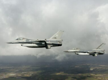 Two Dutch F-16 fighter jets flying in formation