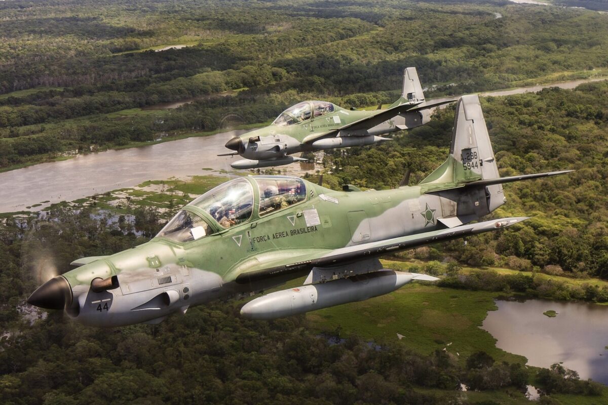 Brazilian Air Force Embraer A-29 Super Tucano aircraft in flight over the Amazon Rainforest