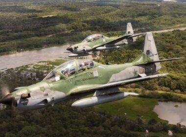 Brazilian Air Force Embraer A-29 Super Tucano aircraft in flight over the Amazon Rainforest