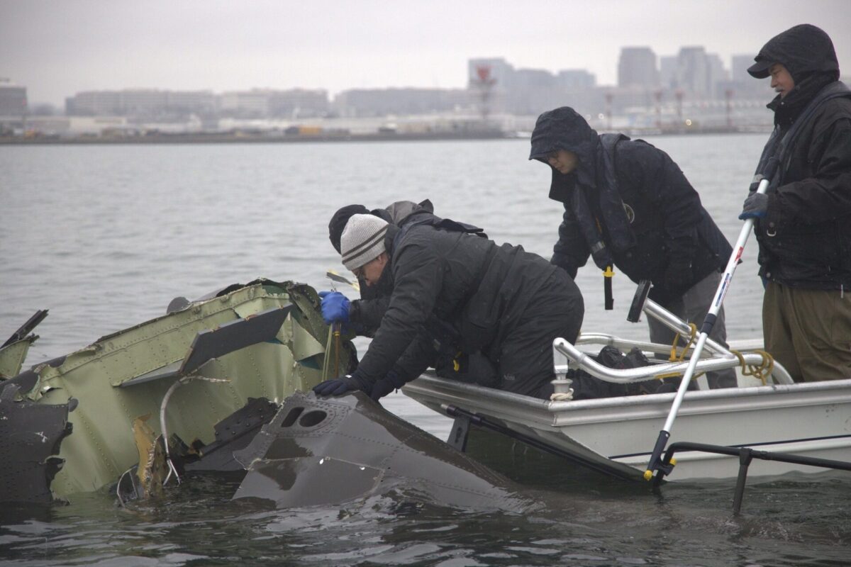 NTSB investigators recovering wreckage of the Sikorsky UH-60 Black Hawk from the Potomac River near Reagan National Airport