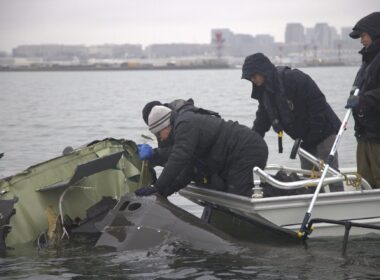 NTSB investigators recovering wreckage of the Sikorsky UH-60 Black Hawk from the Potomac River near Reagan National Airport