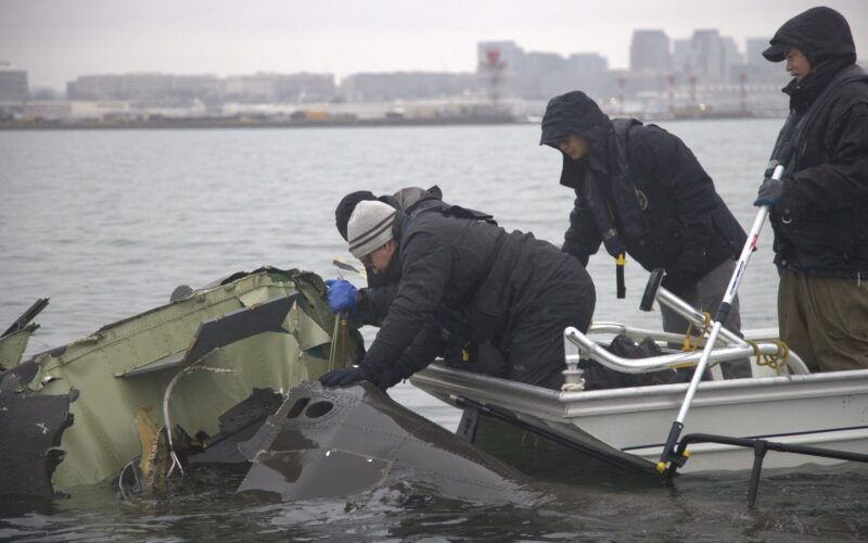 NTSB investigators recovering wreckage of the Sikorsky UH-60 Black Hawk from the Potomac River near Reagan National Airport