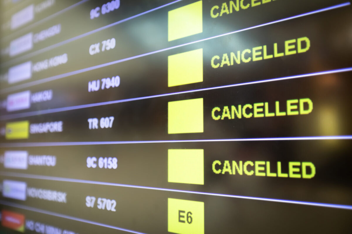 Flights cancelled and delayed on airport departure board