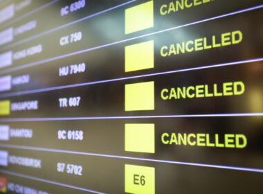 Flights cancelled and delayed on airport departure board