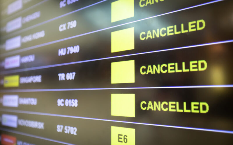 Flights cancelled and delayed on airport departure board