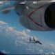 A Chinese fighter flying close to the nacelle of a US aircraft