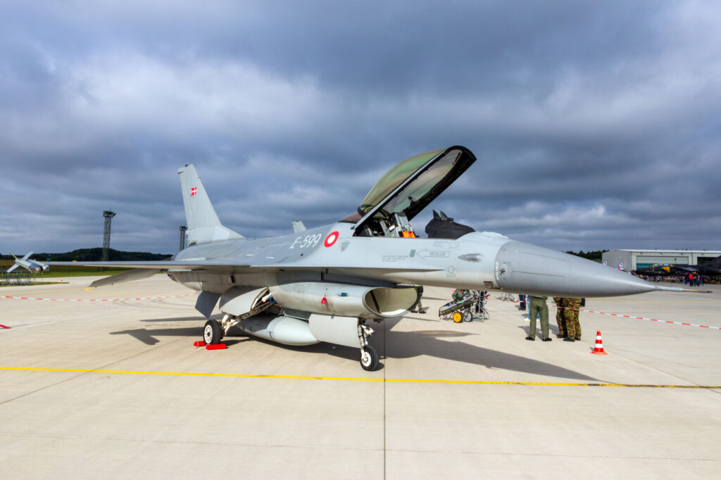 A Danish F-16 fighter jet parked on an air base