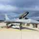 A Danish F-16 fighter jet parked on an air base