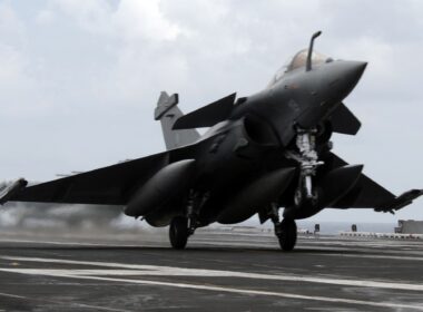 A French Dassault Rafale fighter aircraft conducts touch and go landings aboard the aircraft carrier USS Dwight D. Eisenhower.