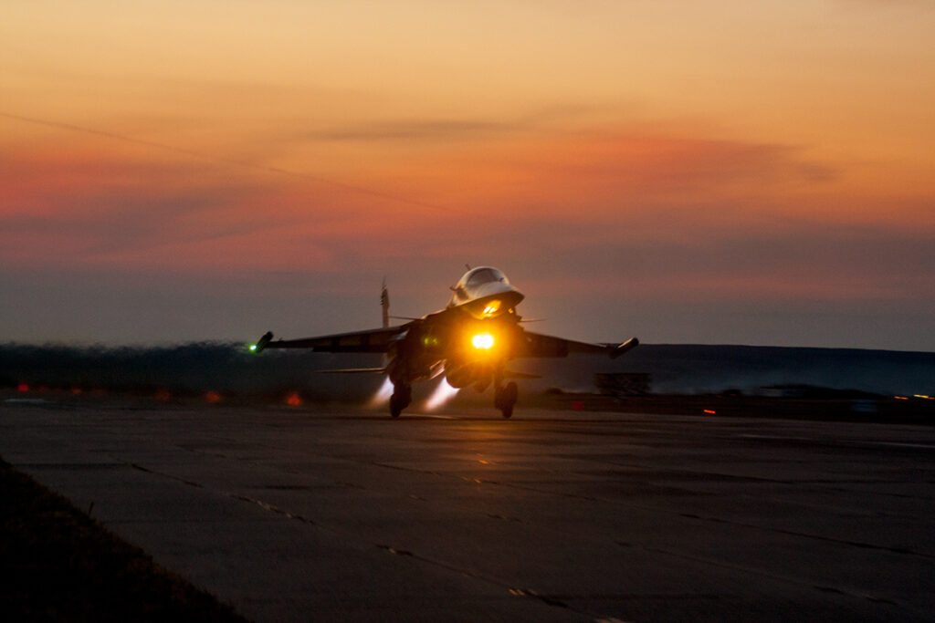 A Russian Su-34 aircraft taking off by night