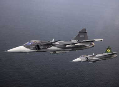 A Sweden and a Brazilian Gripen fighters flying in formation