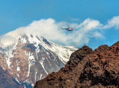 A helicopter flies in Kamchatka, Russia