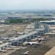 Aerial view of JFK airport terminal tower and apron