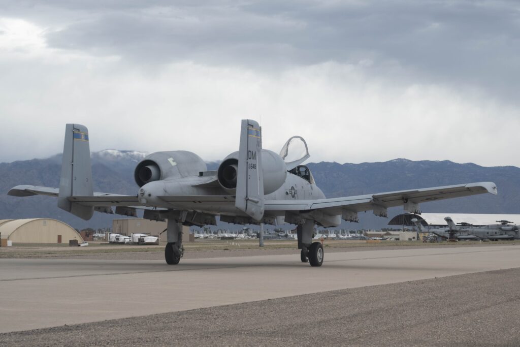 An A-10C Thunderbolt II aircraft taxis towards the 309th Aircraft Maintenance and Regeneration Group at Davis-Monthan Air Force Base