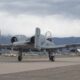 An A-10C Thunderbolt II aircraft taxis towards the 309th Aircraft Maintenance and Regeneration Group at Davis-Monthan Air Force Base