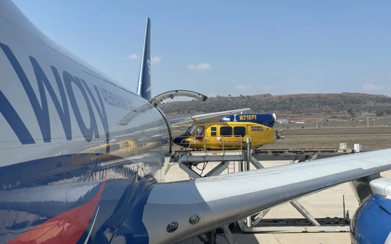 Bell helicopter being lifted into a Boeing 747