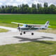 Cessna 172 is landing Small airplane in the sky student is learning how to land on the ground