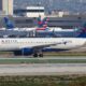 Delta Airlines Airbus A320 and American Airlines jet at Los Angeles airport LAX in the USA