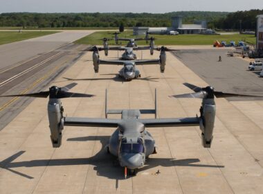 Four V-22 Osprey tiltrotor aircraft parked