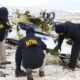 Investigators from National Transport Safety Board look over plane wreckage in Nevada after a Pilatus PC 12 airplane crashed