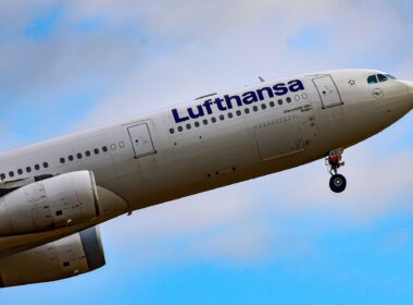 LUFTHANSA AIRLINES Airbus A330-300 over airport.