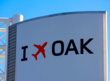 I,Fly,Oakland,Sign,With,Red,Airplane,Logo,On,The