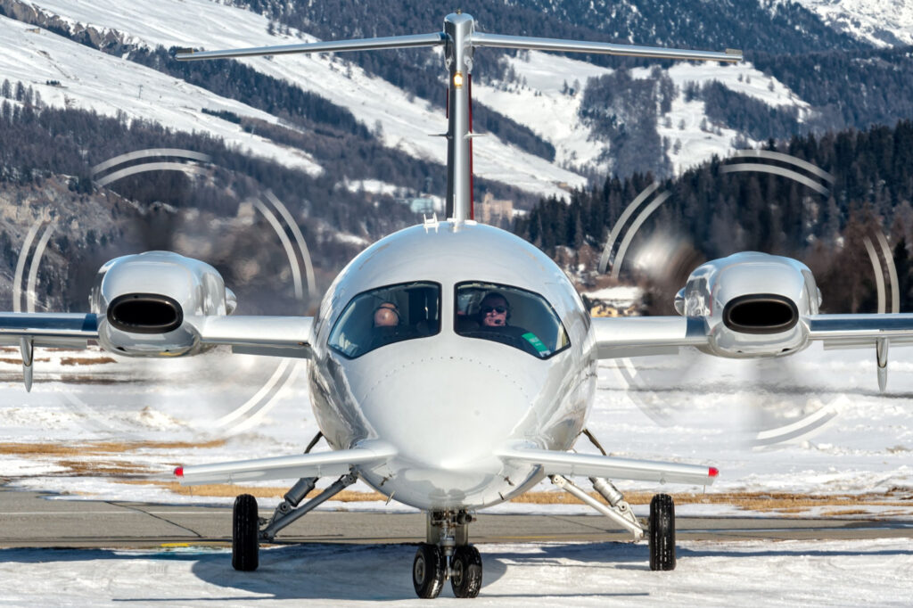 Piaggio P180 over snowed taxiway