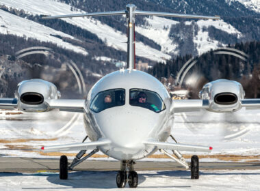 Piaggio P180 over snowed taxiway