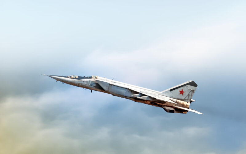 Russian air force Mig 25 foxbat supersonic military twin jet engine fighter interceptor aircraft warbird plane performing high speed pass aerial exterior view