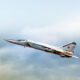 Russian air force Mig 25 foxbat supersonic military twin jet engine fighter interceptor aircraft warbird plane performing high speed pass aerial exterior view