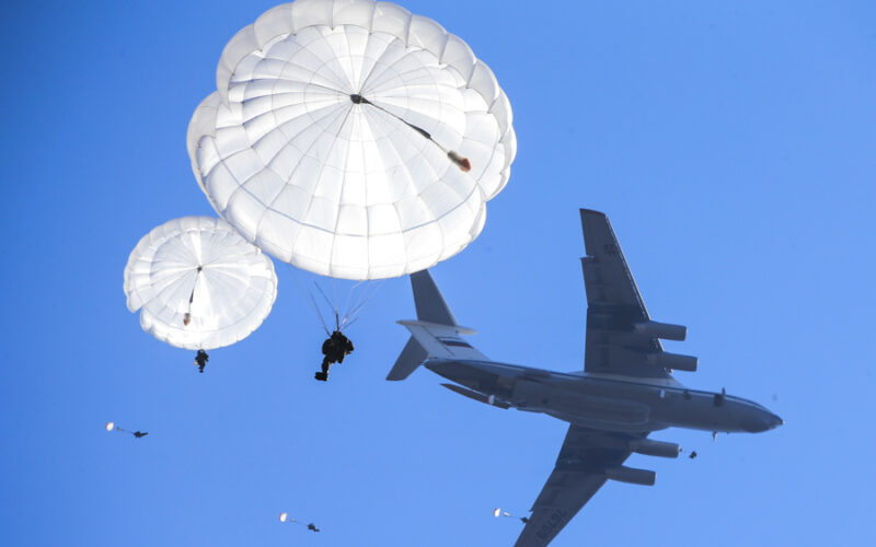 Russian paratroopers jumping from an Ilyushin Il-76 aircraft