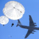 Russian paratroopers jumping from an Ilyushin Il-76 aircraft