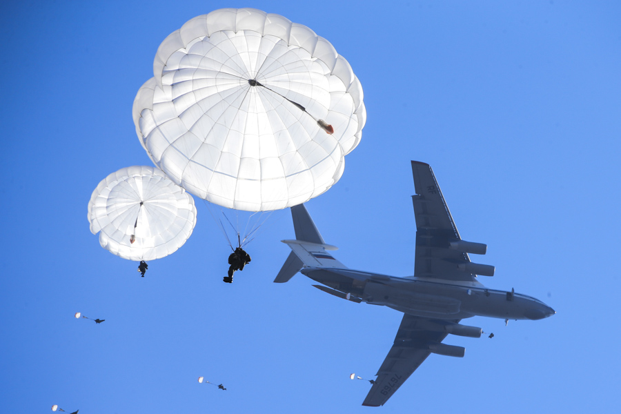 Russian paratroopers jumping from an Ilyushin Il-76 aircraft