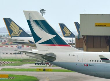 Tails of Cathay Pacific and Singapore Airlines aircraft at Changi Airport