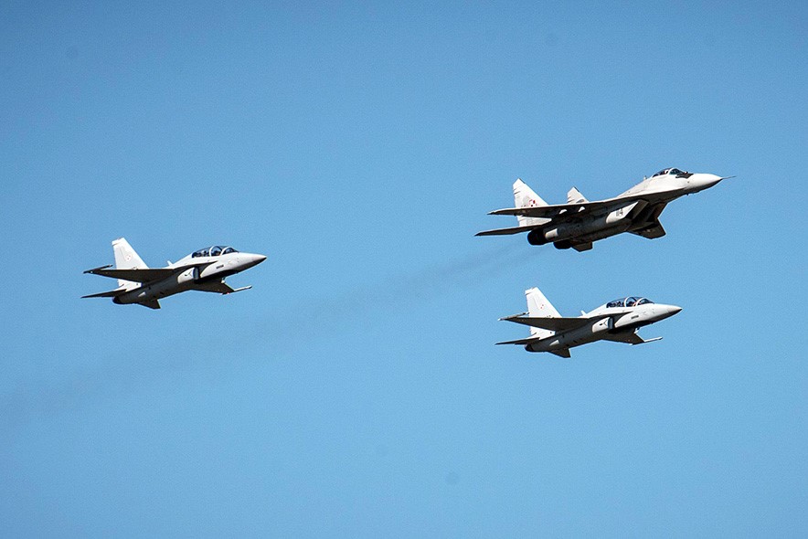 Two FA-50 flying in formation with a Polish MiG-29