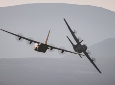 Two RAF C-130 Hercules flying in formation