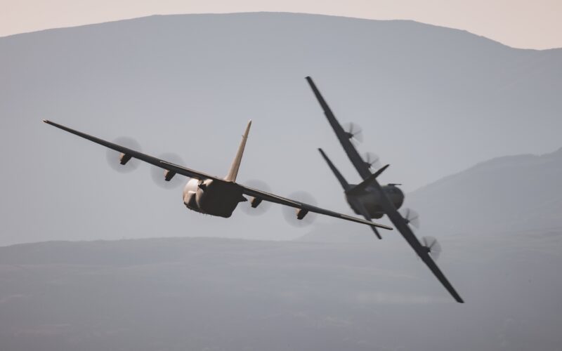 Two RAF C-130 Hercules flying in formation