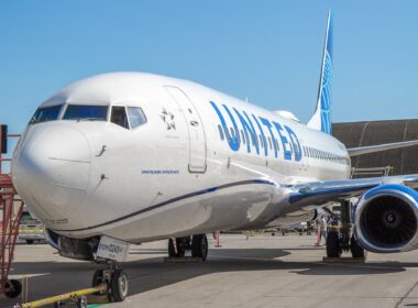 A United Airlines Boeing 737-900ER suffered significant damage to its fuselage following an American Airlines baggage cart hitting it at ORD