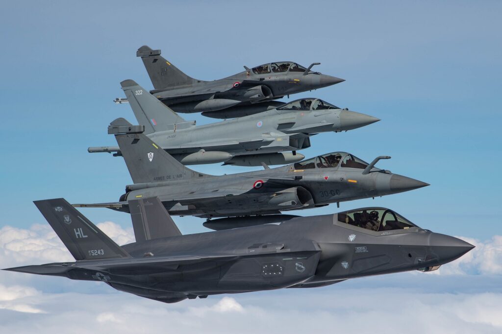 U.S. Air Force, French and Royal Air Force fighter aircraft participate in formation flight