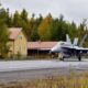 a_finnish_hornet_on_a_highway_next_to_a_house.jpg