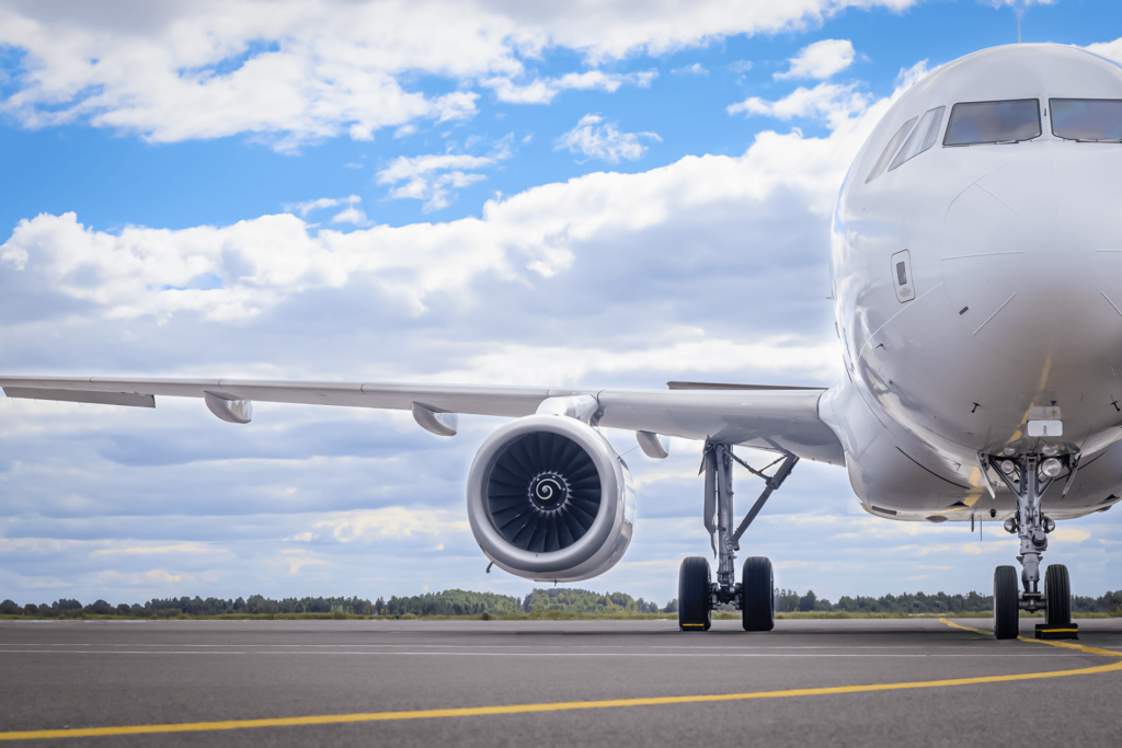 a_white_aircraft_parked_on_the_apron.png