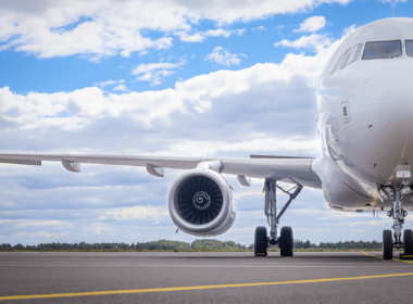 a_white_aircraft_parked_on_the_apron.png