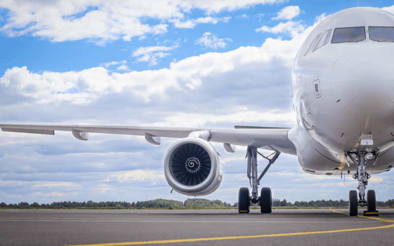 a_white_aircraft_parked_on_the_apron.png