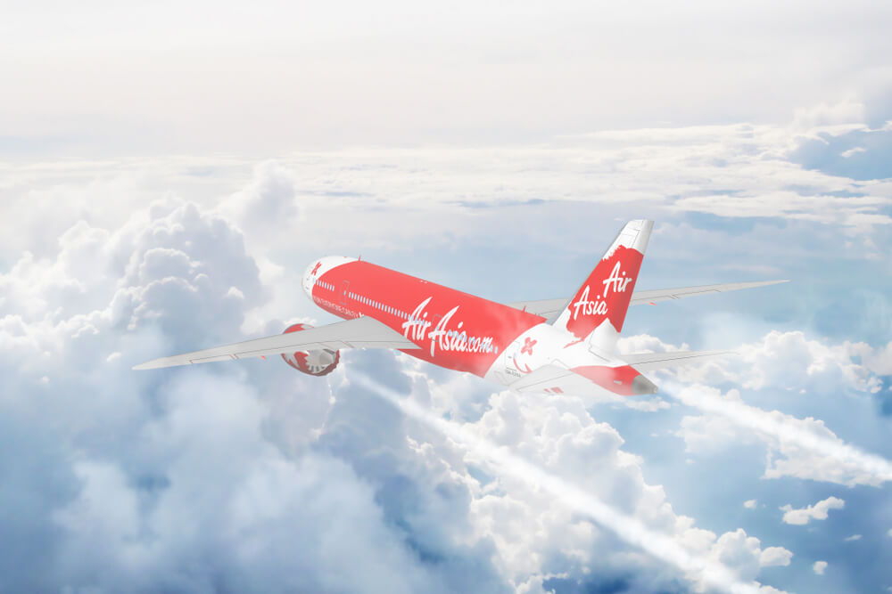 aerial_view_of_air_asia_cruising_above_fluffy_white_clouds.jpg