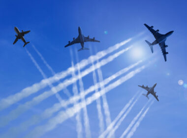 aircraft_and_contrails_against_a_blue_sky.jpg