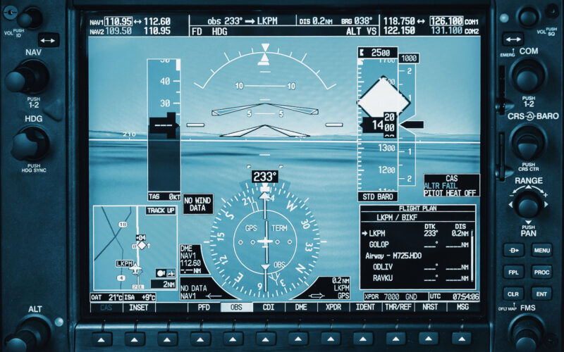 Computer in cockpit Airplane glass cockpit display with weather radar and engine gauges in small private airplane