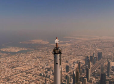 an_emirates_cabin_crew_stands_on_top_of_the_burj_khalifa.jpg