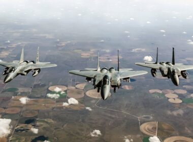 an_f-15ex_eagle_ii_flying_alongside_two_f-15c_fighters.jpg