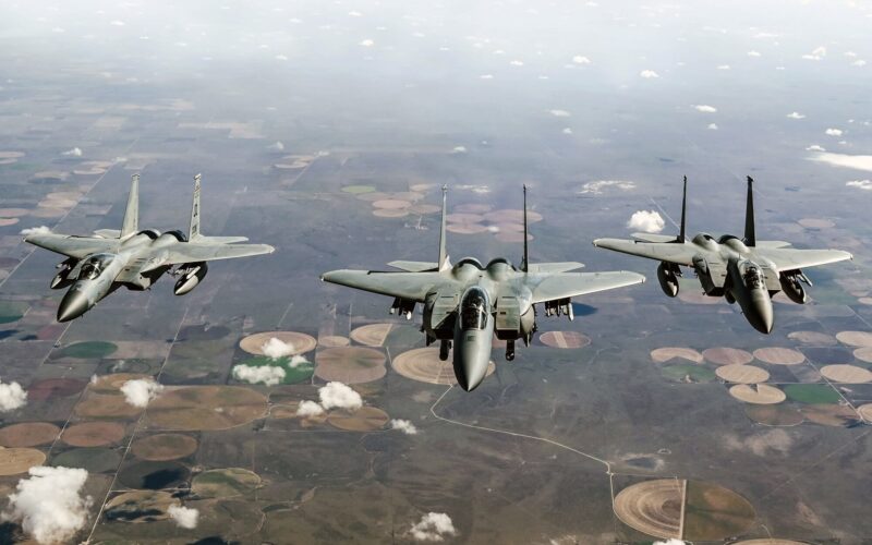 an_f-15ex_eagle_ii_flying_alongside_two_f-15c_fighters.jpg